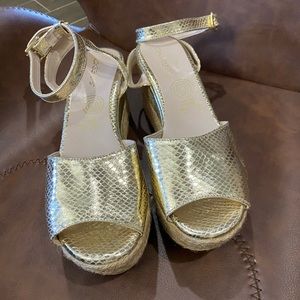 Gold sandals wedge’s size 9.
